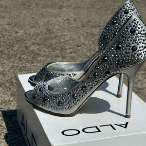 Also brand silver shoes covered in silver rhinestones. Great used condition